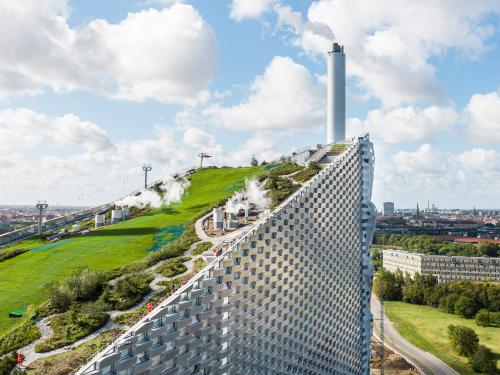 Steep pitched green roof with grass and hiking paths